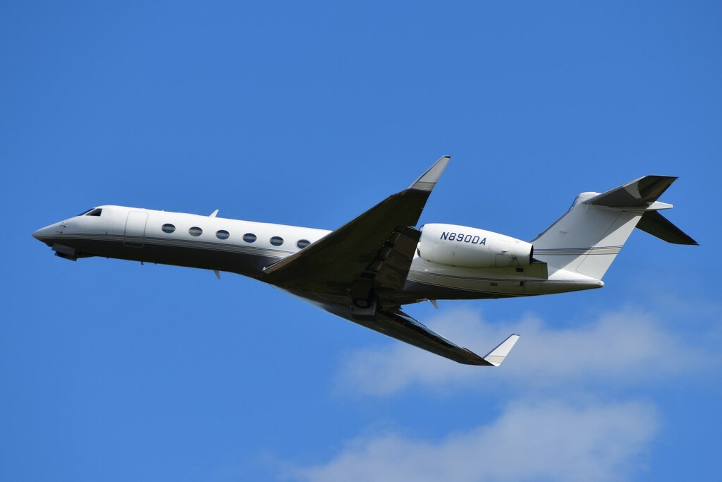 Private jet on runway at sunset